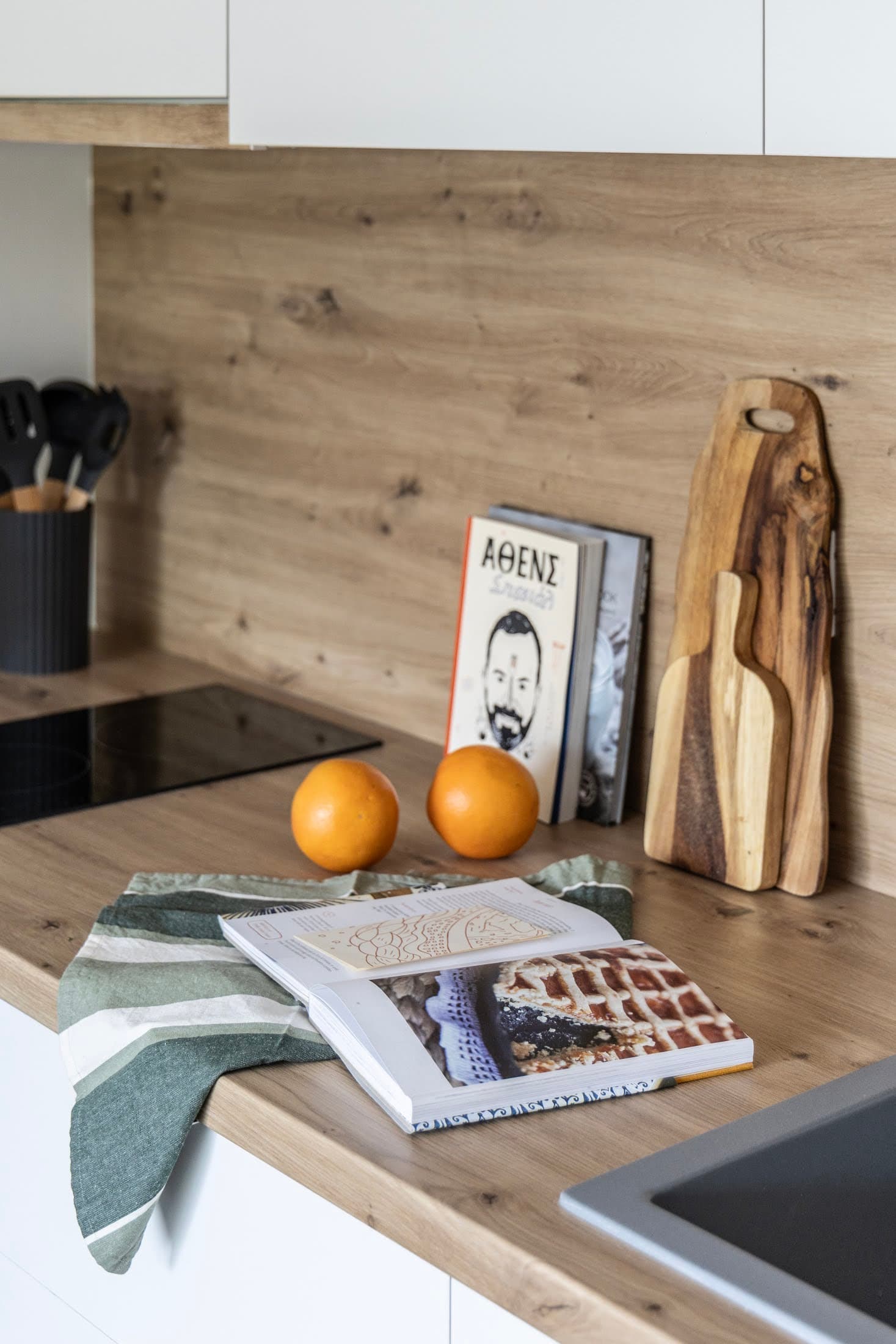 Close-up of wooden kitchen countertop with cookbooks
